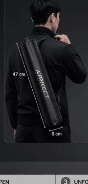 Commuter carrying AIRVOLT X1 cylinder over shoulder like an umbrella